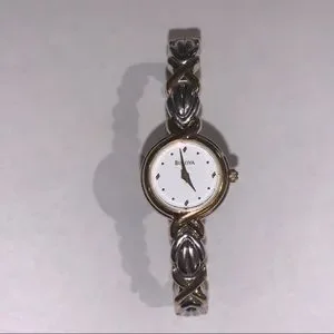 Bulova watch 
Delicate white faced watch with woven bracelet 
6 3/4 
1/4 width Bulova Phantom Watch – Michaels Jewelers main image 3